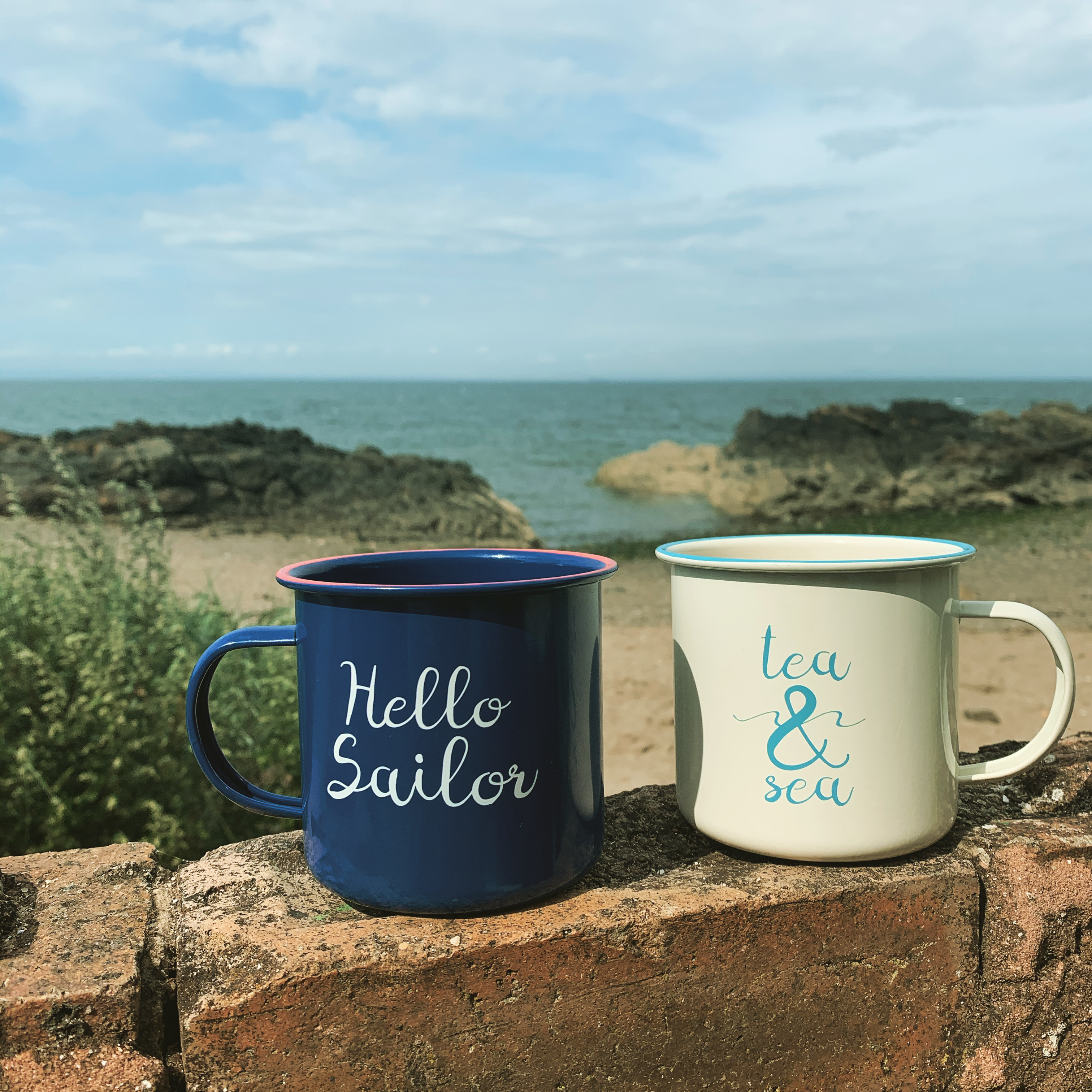 Mugs with beach in background